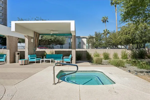 a view of swimming pool from a lounge chair