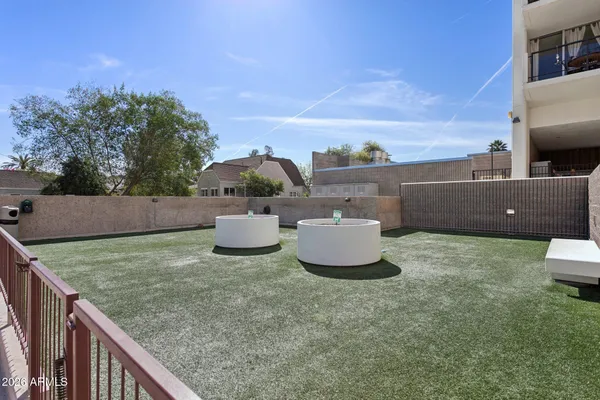 a view of a chairs and table in a patio