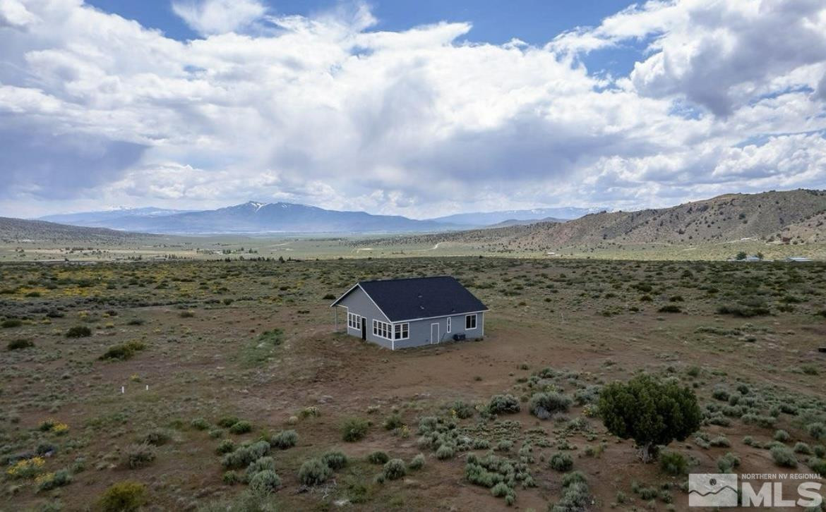 1300 Freds Mountain Road Reno, NV 89508 - Photo 8 of 24 a view of a dry yard with lots of trees