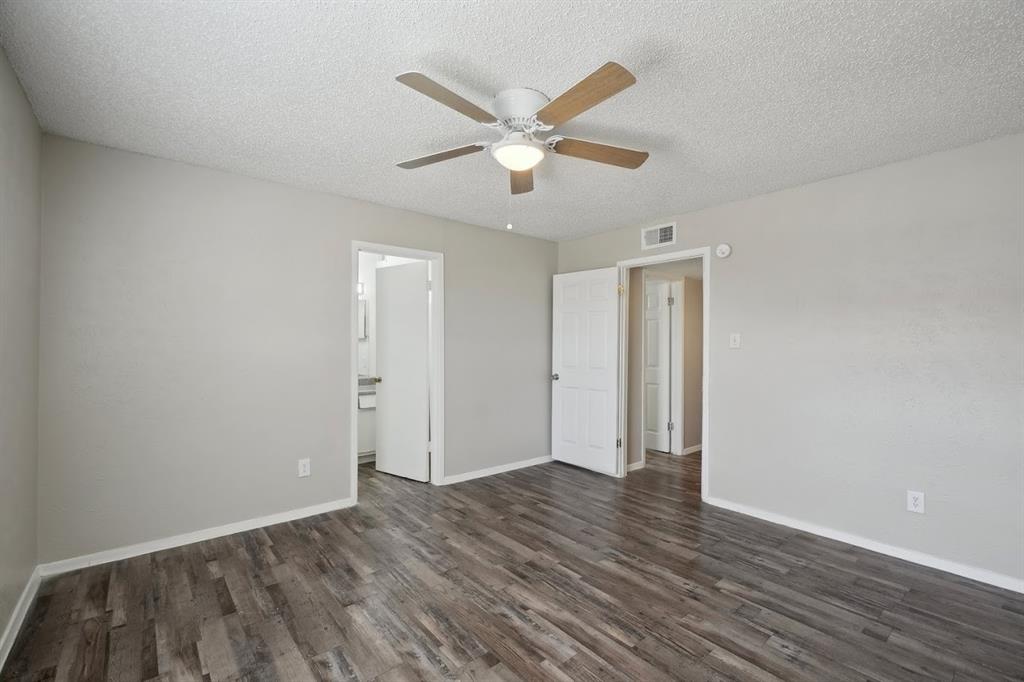 306 Vine Street, Unit B Euless, TX 76040 - Photo 5 of 6 a view of an empty room with wooden floor