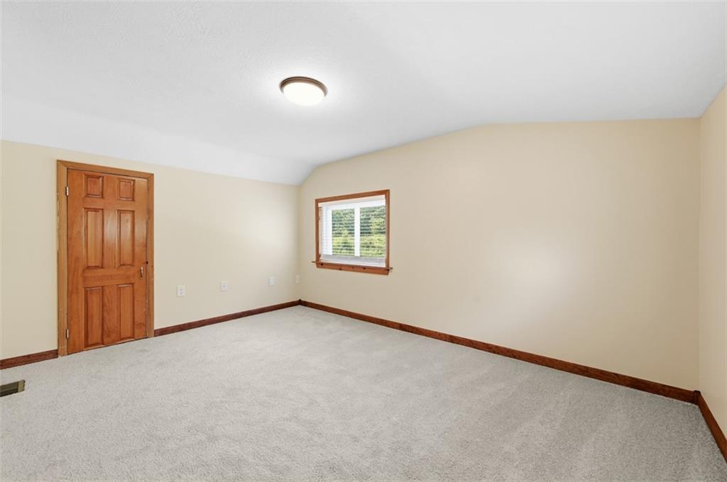 123 Cemetery Road Slippery Rock, PA 16057 - Photo 29 of 33 The other upstairs bedroom offers a large space for a variety of furnishings.