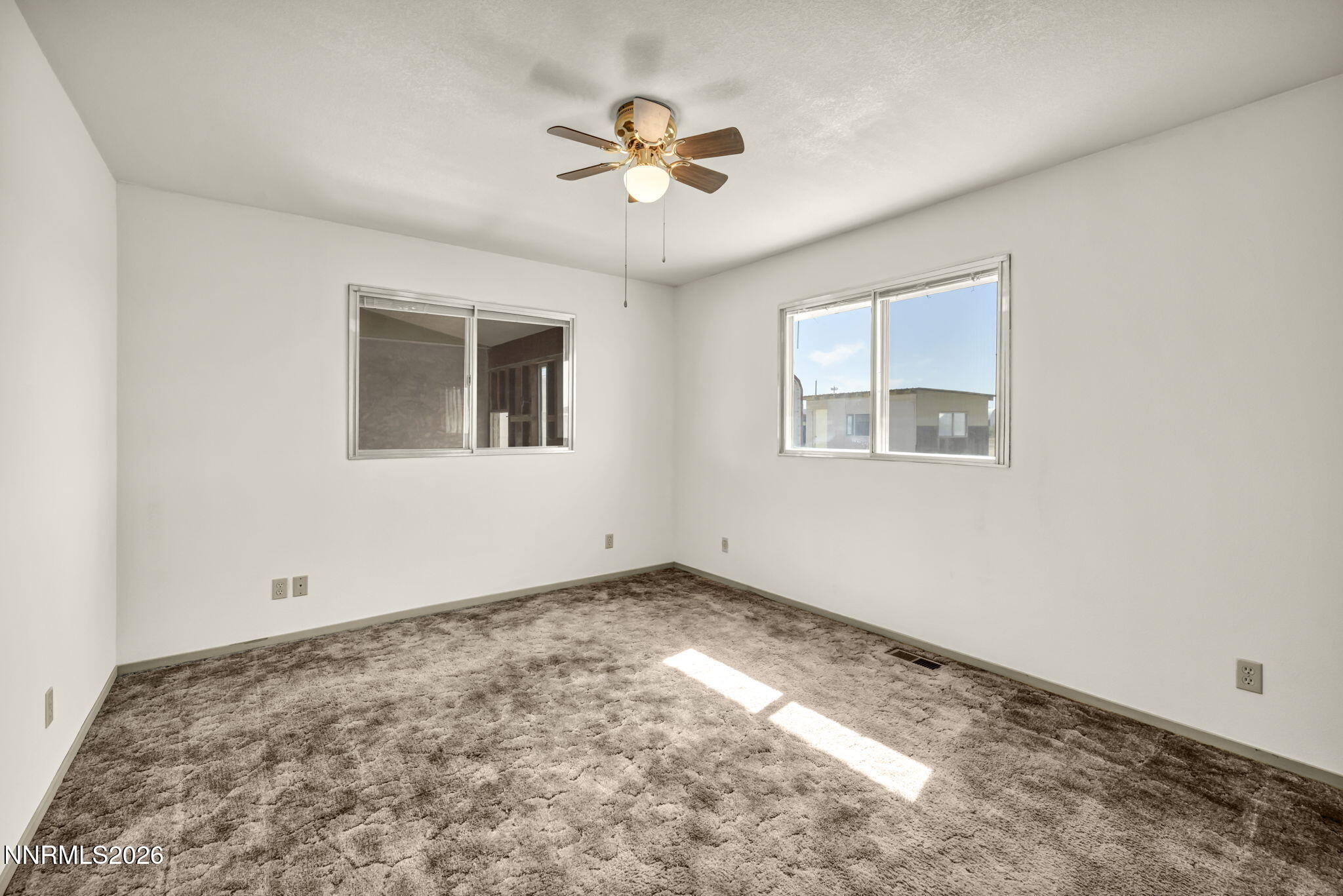 5250 Stillwater Road Fallon, NV 89406 - Photo 19 of 53 a view of an empty room with a window