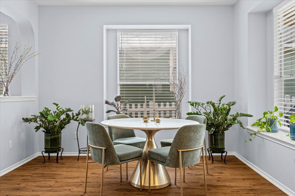 501 Sampson Kyle, TX 78640 - Photo 14 of 31 a view of a dining room with furniture window and wooden floor