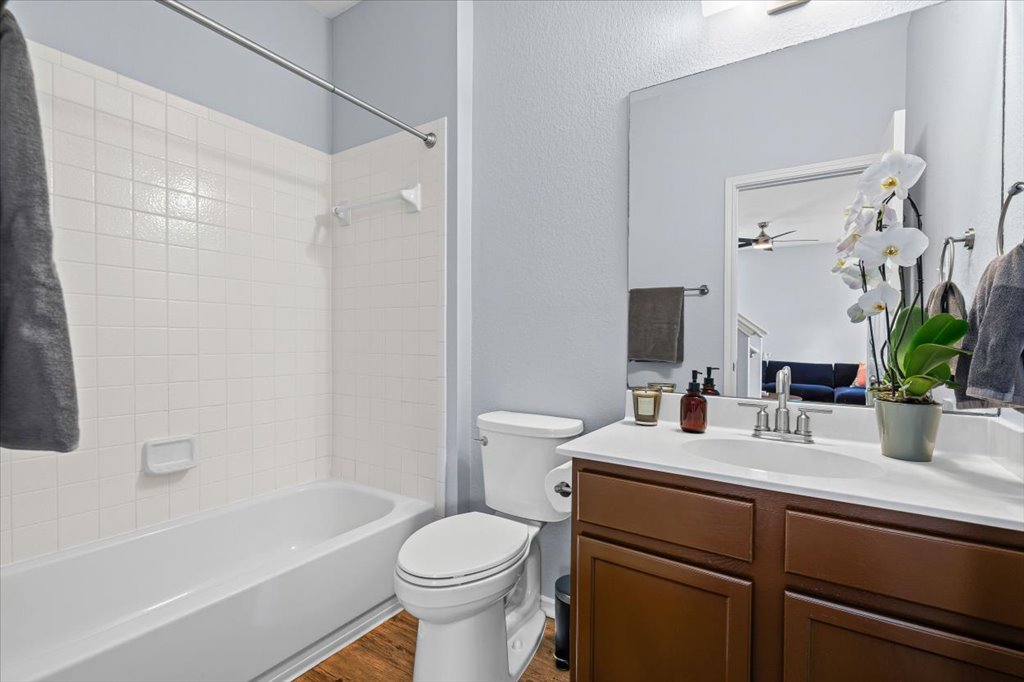 501 Sampson Kyle, TX 78640 - Photo 16 of 31 a bathroom with a sink a toilet and shower