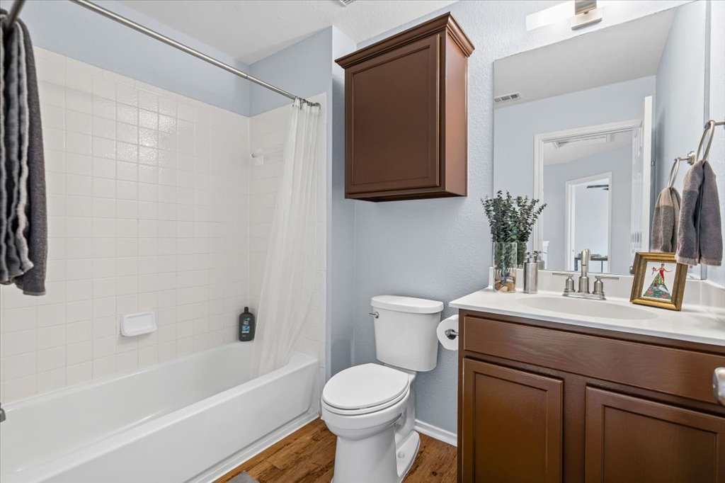 501 Sampson Kyle, TX 78640 - Photo 20 of 31 a bathroom with a sink toilet and shower