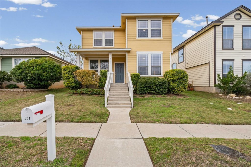 501 Sampson Kyle, TX 78640 - Photo 2 of 31 a front view of a house with garden