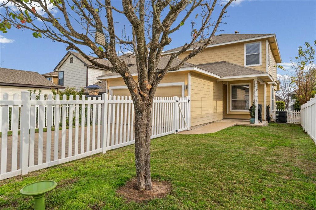 501 Sampson Kyle, TX 78640 - Photo 23 of 31 a front view of a house with garden