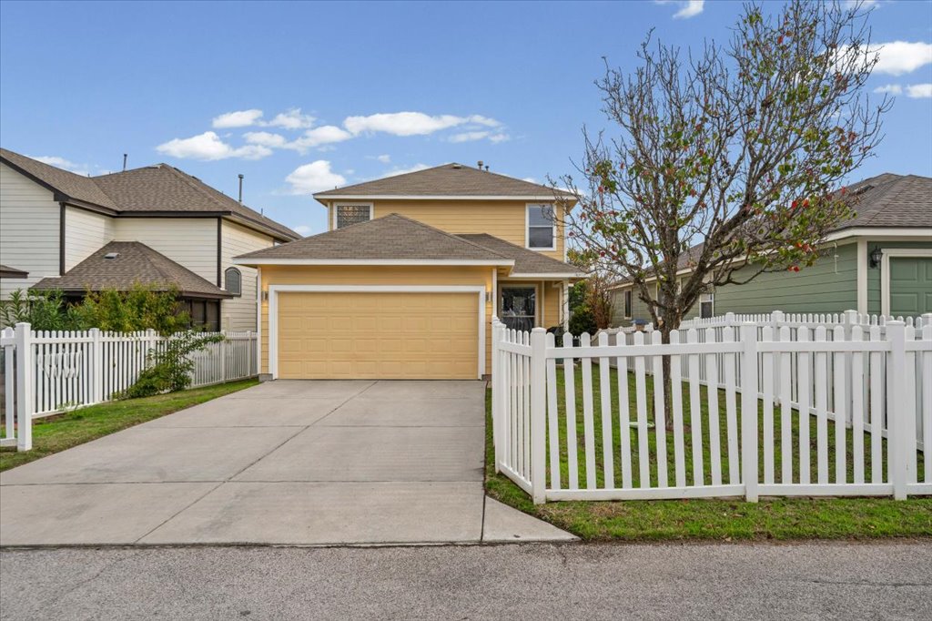501 Sampson Kyle, TX 78640 - Photo 24 of 31 a front view of a house with a garden