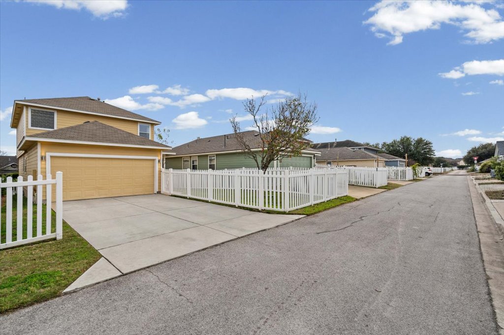 501 Sampson Kyle, TX 78640 - Photo 25 of 31 a view of a house with a yard and garage