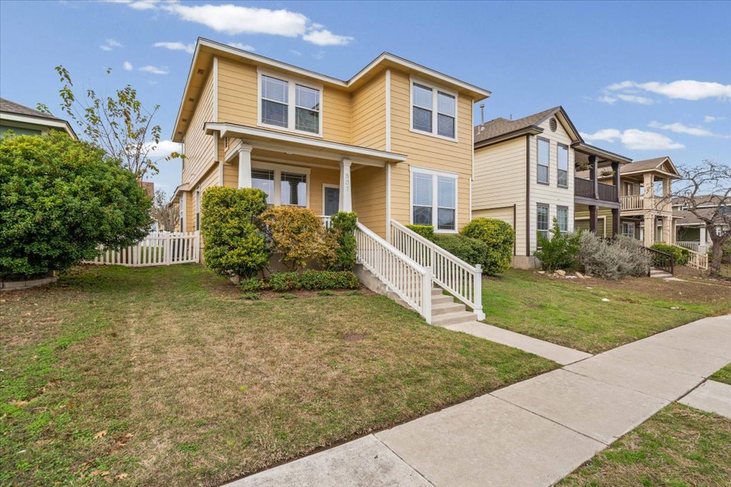 501 Sampson Kyle, TX 78640 - Photo 3 of 31 a front view of a house with garden