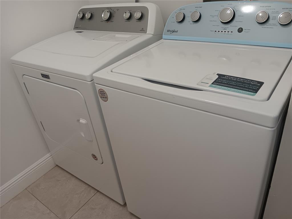 1265 Southwest 46th Avenue, Unit 2207 Pompano Beach, FL 33069 - Photo 11 of 33 a close up view of washer and dryer