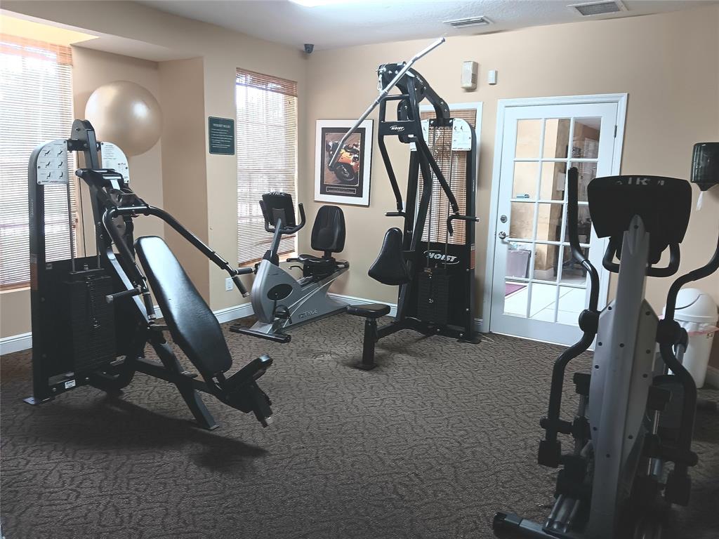 1265 Southwest 46th Avenue, Unit 2207 Pompano Beach, FL 33069 - Photo 29 of 33 a view of a room with gym equipment