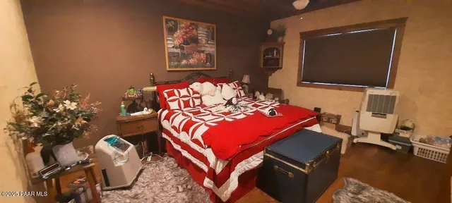 a bedroom with bed and window