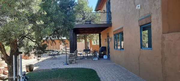 a view of a backyard with sitting area
