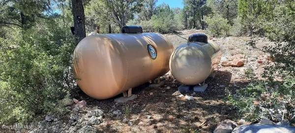 a kitchen with stainless steel appliances a sink and cabinets