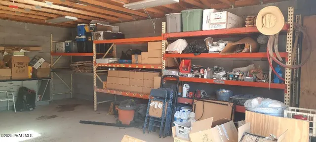 a view of a house with a floor to ceiling window and wooden floor