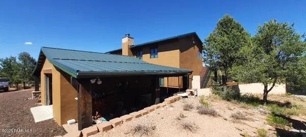 a pathway of a house with a yard