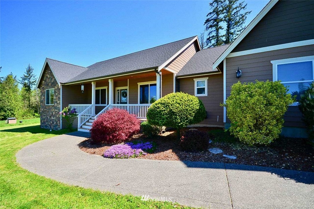 19930 Bear View Lane Southwest Rochester, WA 98579 - Photo 2 of 25 a front view of a house with garden