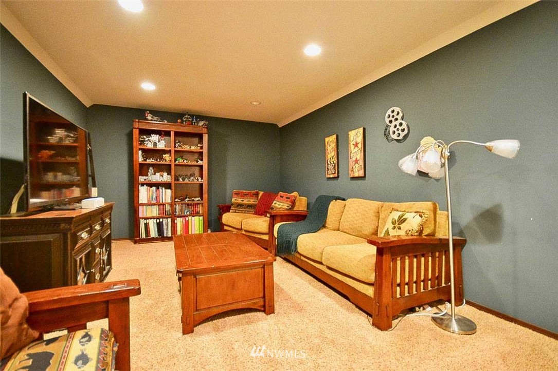19930 Bear View Lane Southwest Rochester, WA 98579 - Photo 14 of 25 a bedroom with furniture and a flat screen tv