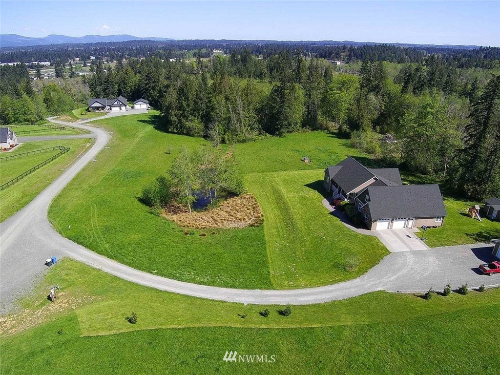 19930 Bear View Lane Southwest Rochester, WA 98579 - Photo 16 of 25 a view of a grassy area with an trees