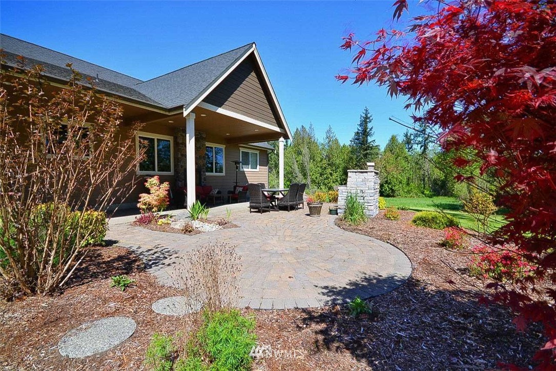 19930 Bear View Lane Southwest Rochester, WA 98579 - Photo 17 of 25 a front view of a house with a yard