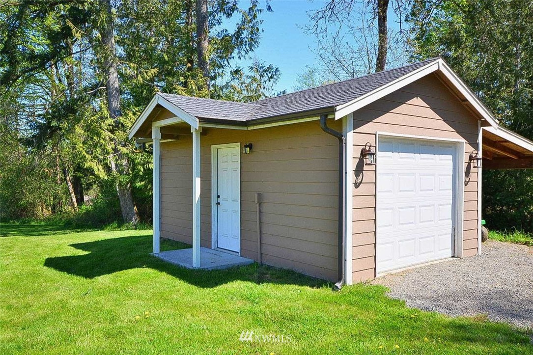 19930 Bear View Lane Southwest Rochester, WA 98579 - Photo 22 of 25 a view of front of house with a yard