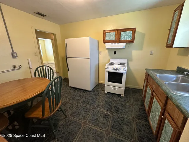 a bedroom with a bed and a table in it