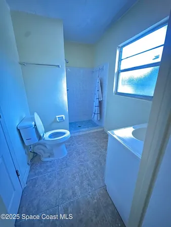 a bathroom with a toilet and a sink