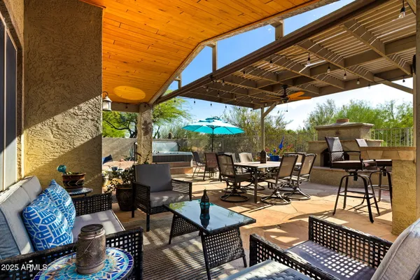 a view of patio with chairs and tables