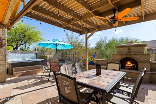 a view of an outdoor space with a table and chairs