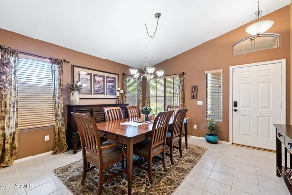 a view of a dining room with furniture and window