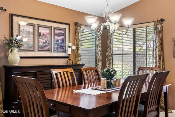 a view of a dining room with furniture and window