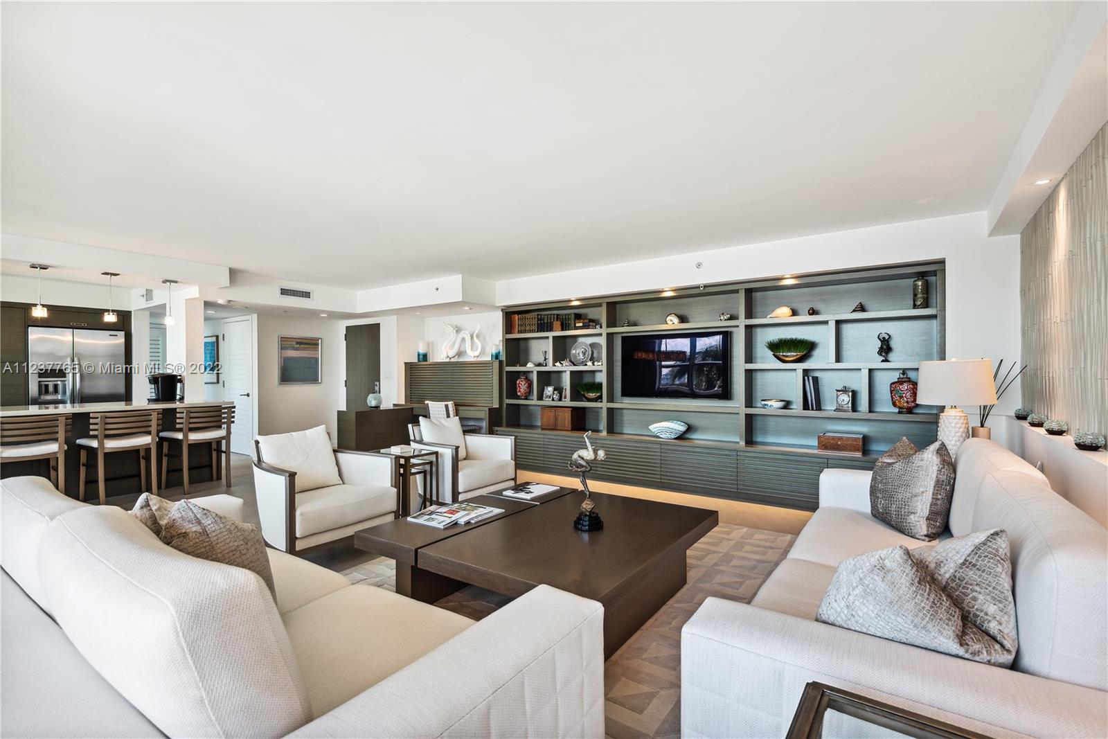 90 Alton Road, Unit TH8 Miami Beach, FL 33139 - Photo 2 of 25 a living room with furniture and a table