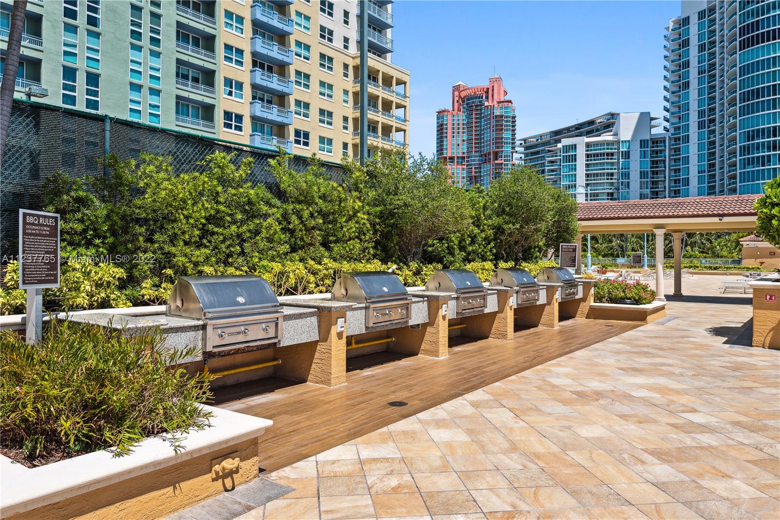 90 Alton Road, Unit TH8 Miami Beach, FL 33139 - Photo 24 of 25 a building view with a sitting space