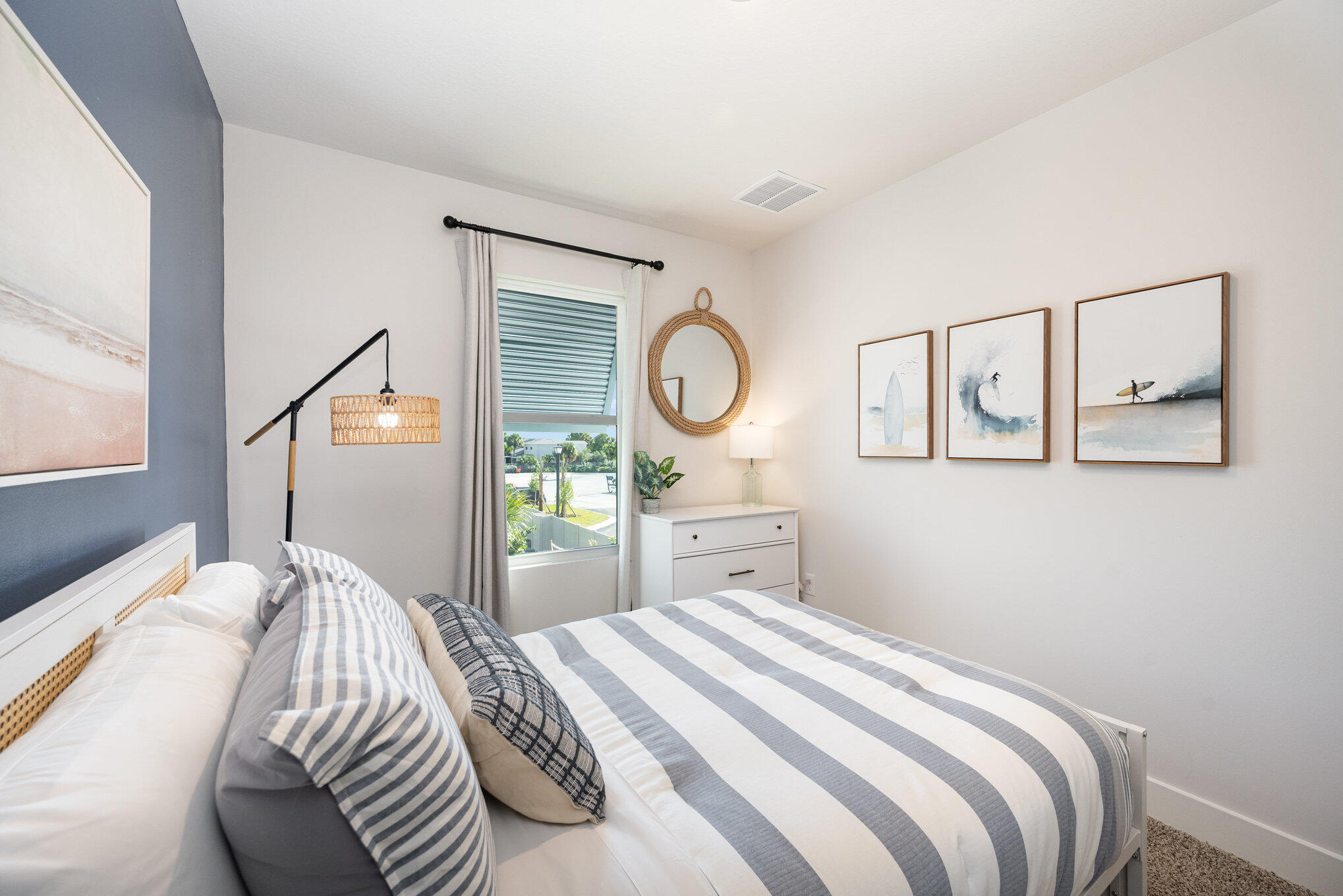 8164 Cobblestone Drive Fort Pierce, FL 34945 - Photo 15 of 17 a bedroom with a bed and a window