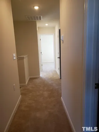 a view of a hallway with closet