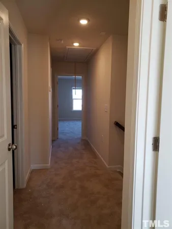a view of hallway with livingroom