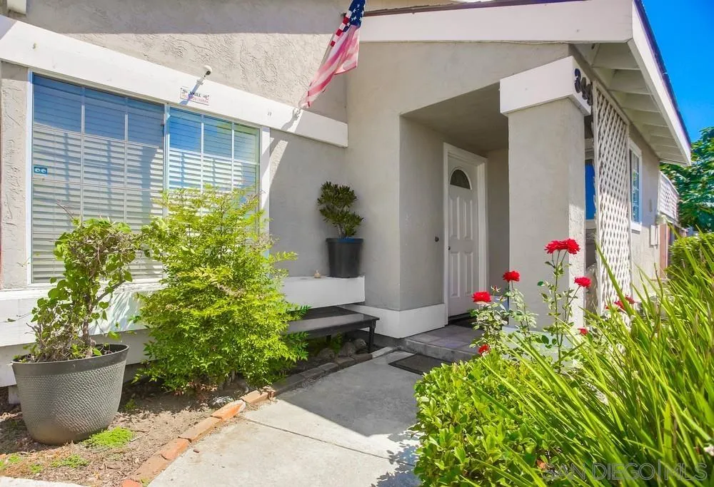 344 Riverview Way Oceanside, CA 92057 - Photo 2 of 41 a potted plant sitting in front of a house