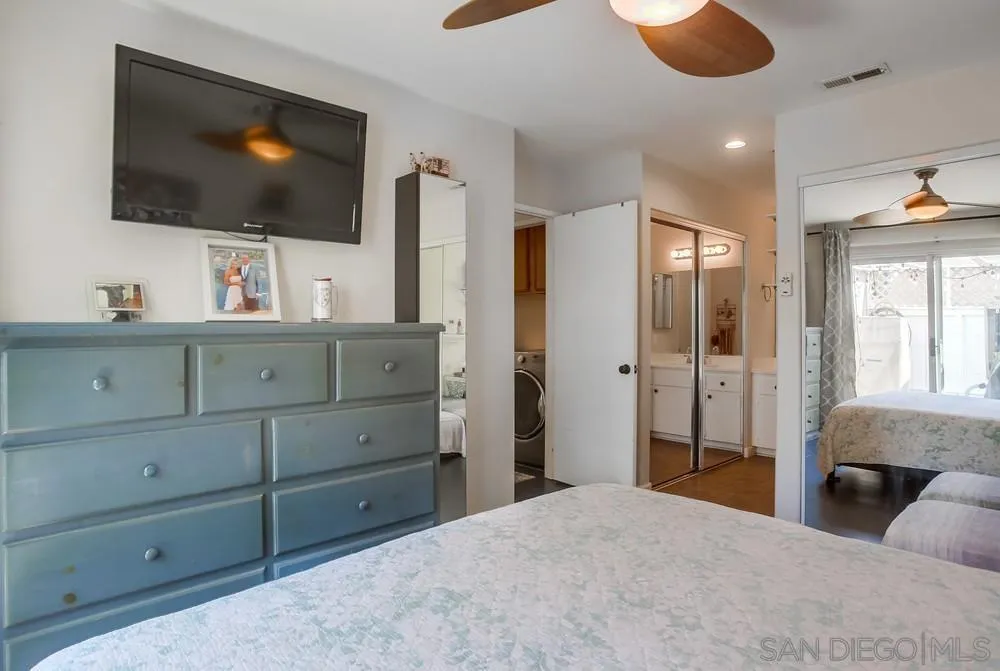 344 Riverview Way Oceanside, CA 92057 - Photo 21 of 41 a bedroom with a bed and a flat screen tv