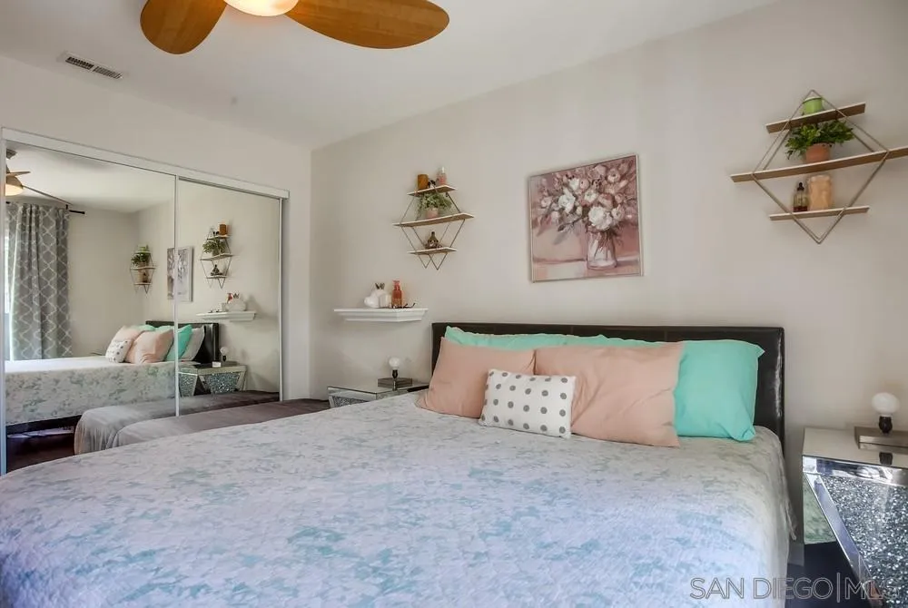 344 Riverview Way Oceanside, CA 92057 - Photo 22 of 41 a bedroom with a bed and cabinets