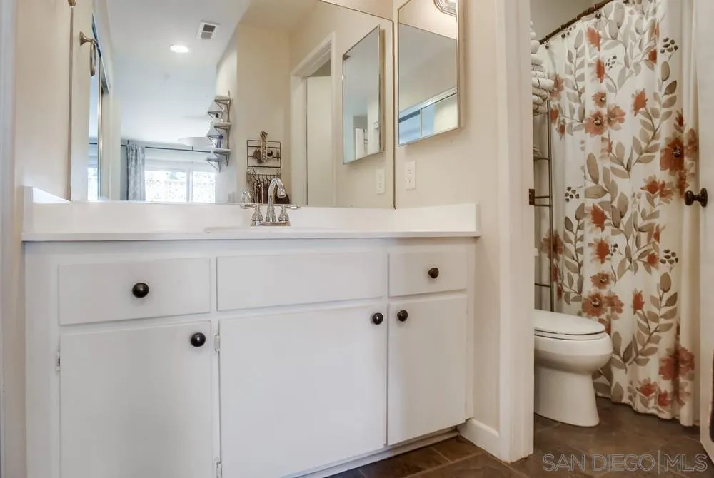 344 Riverview Way Oceanside, CA 92057 - Photo 23 of 41 a bathroom with a sink a toilet and shower