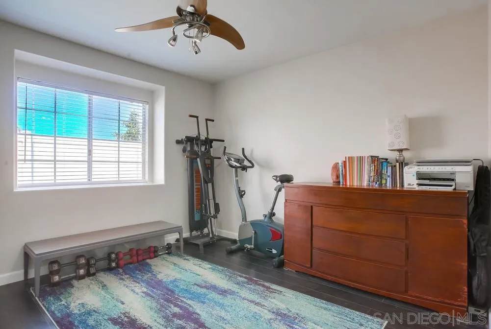 344 Riverview Way Oceanside, CA 92057 - Photo 25 of 41 a bedroom with a bed and a chandelier