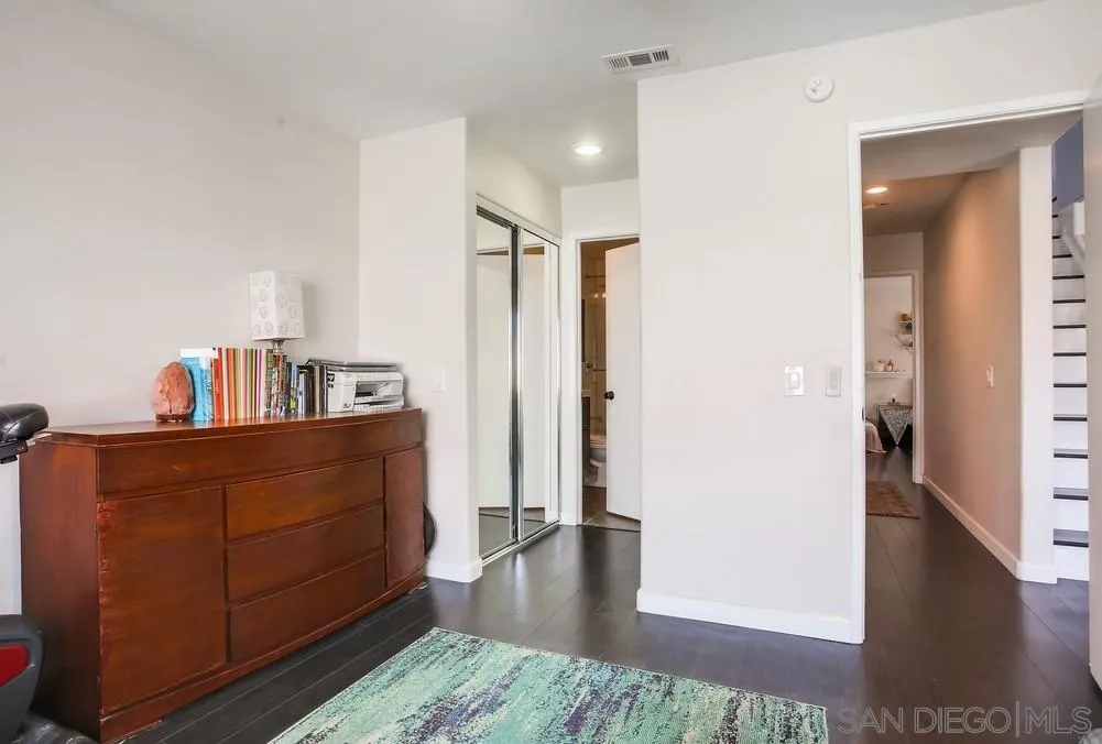 344 Riverview Way Oceanside, CA 92057 - Photo 26 of 41 a room with furniture and wooden floor