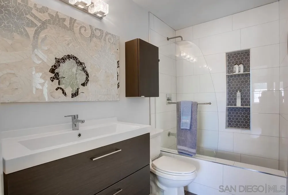 344 Riverview Way Oceanside, CA 92057 - Photo 28 of 41 a bathroom with a toilet sink and mirror