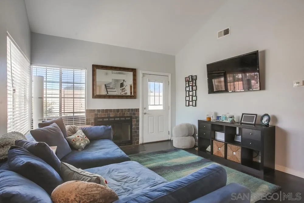 344 Riverview Way Oceanside, CA 92057 - Photo 6 of 41 a living room with furniture and a fireplace