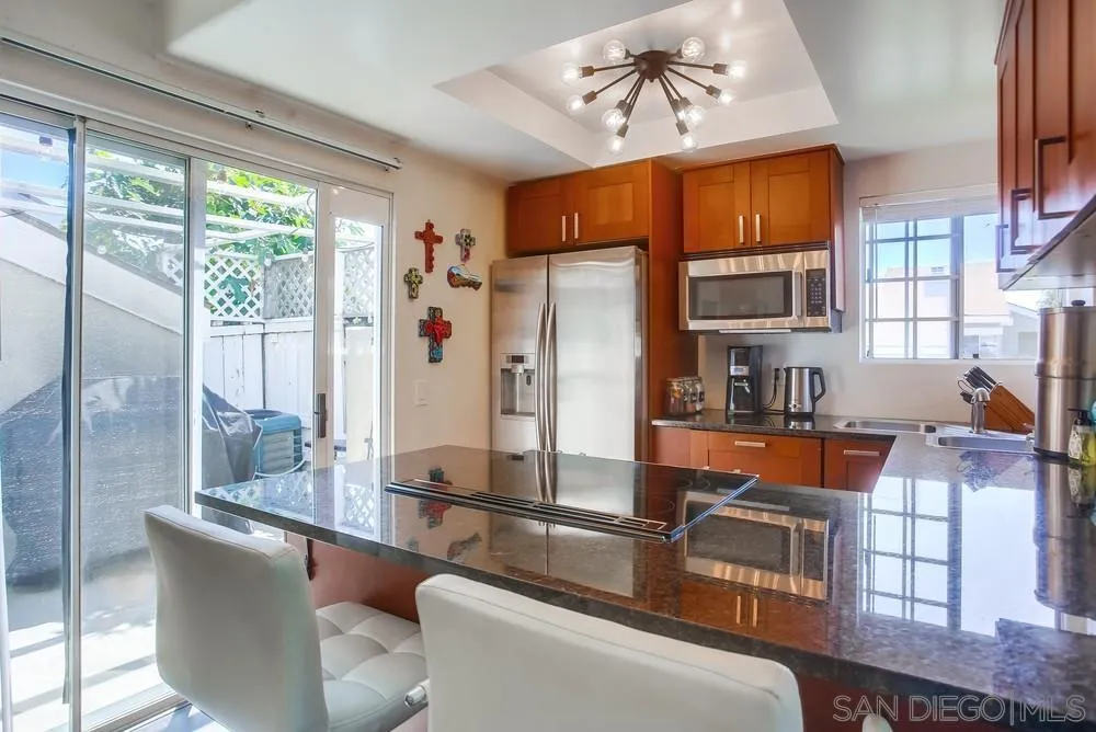 344 Riverview Way Oceanside, CA 92057 - Photo 10 of 41 a living room with stainless steel appliances granite countertop furniture and a window