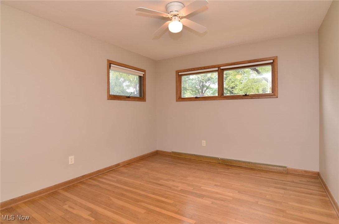 2071 Wyndham Road Akron, OH 44313 - Photo 22 of 42 Bedroom with ceiling fan/light and wood flooring.