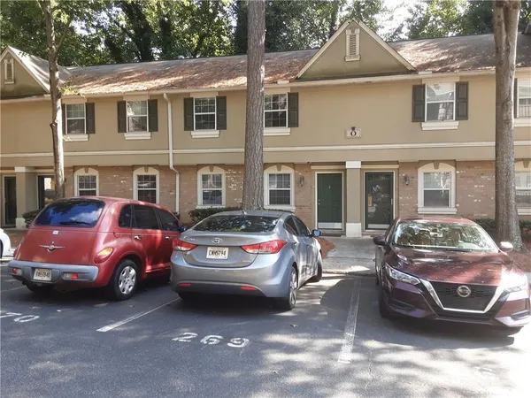 a front view of a house with parking space