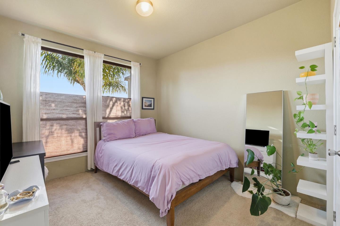 125 North Mary Avenue, Unit 17 Sunnyvale, CA 94086 - Photo 21 of 46 a bedroom with a bed potted plant with the window