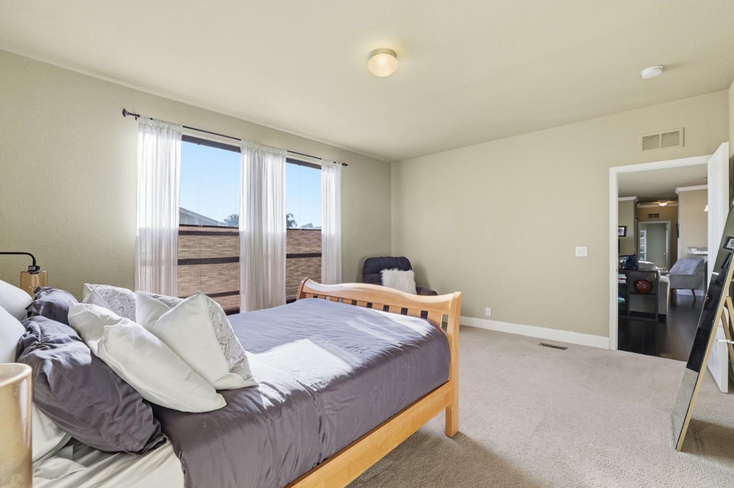 125 North Mary Avenue, Unit 17 Sunnyvale, CA 94086 - Photo 26 of 46 a bedroom with a bed and wooden floor